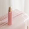 Pink cosmetic bottle beauty product still life